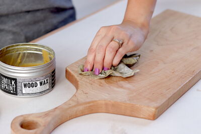 Using wood wax by Real Milk Paint Co. to enhance the natural beauty of maple charcuterie board