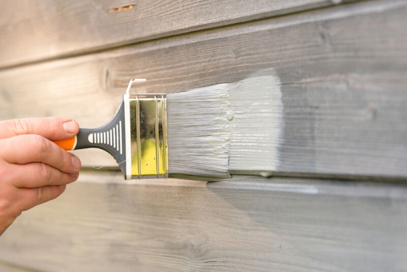 an image showing the right brush techniques on how to paint shiplap