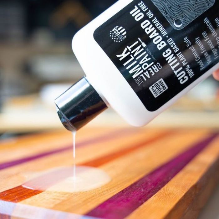 wood cutting board oil poured in a colorful chopping board