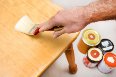 applying finishing oil on fully cured dining table