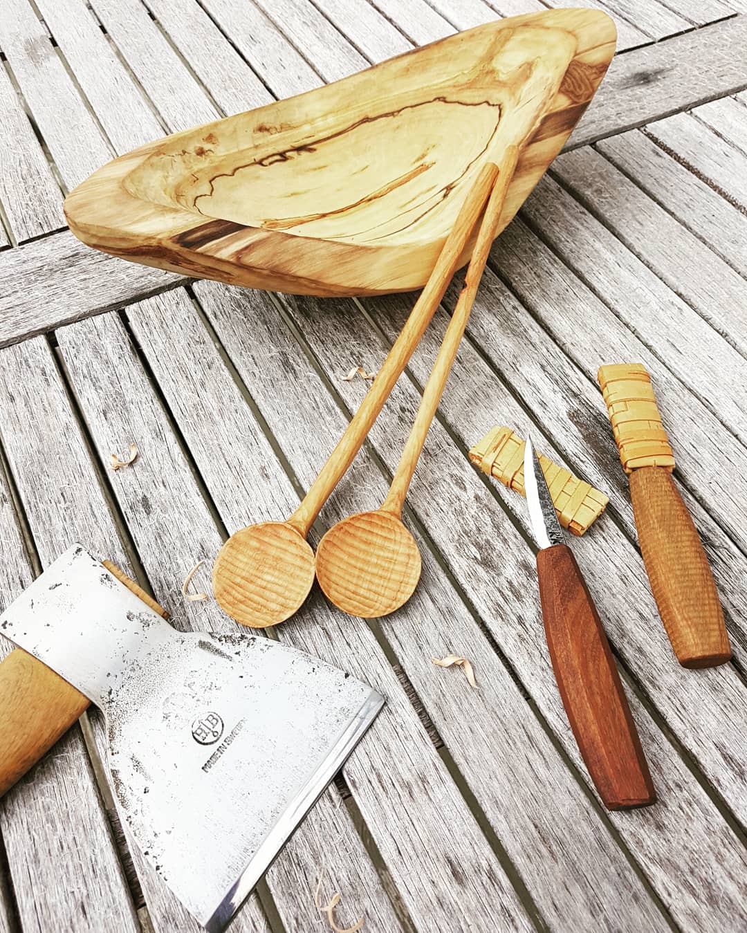 Wooden spoons, knives, axe, and other wood carvings