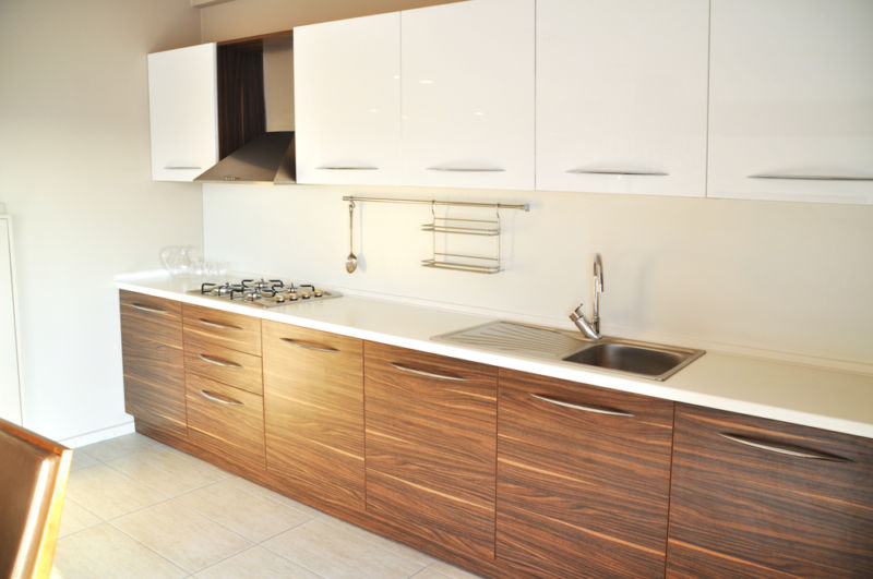 Using tung oil to seal concrete countertop on a modern kitchen