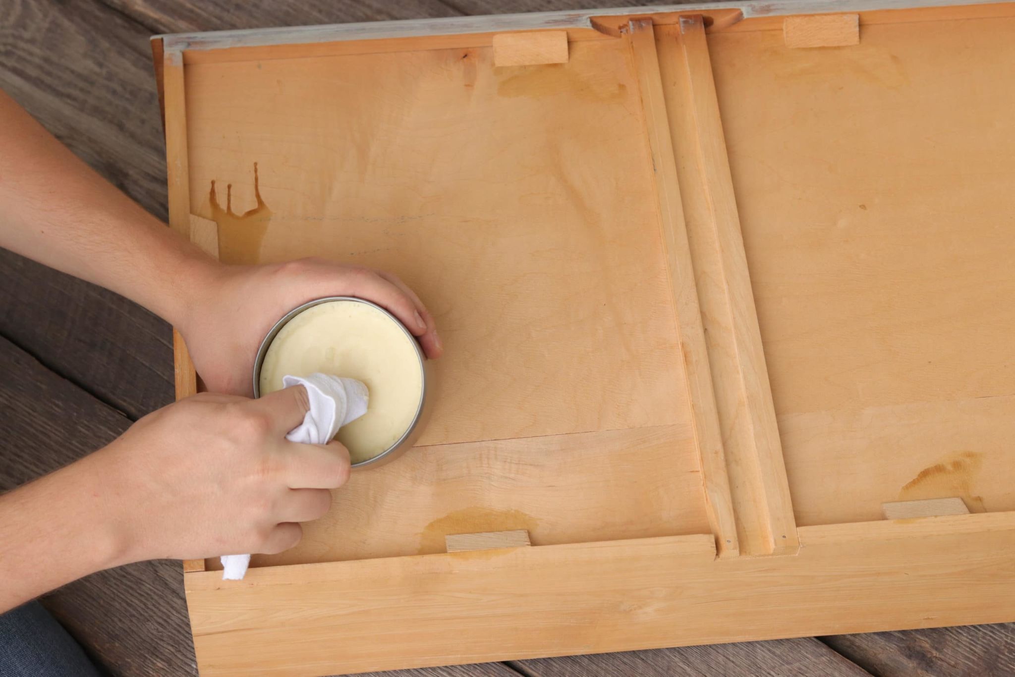 Dipping clothher into wood wax