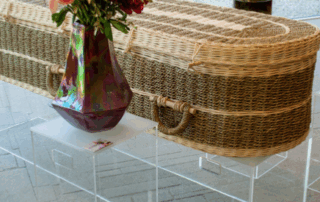 Wicker eco-friendly casket displayed in a natural light setting as part of a sustainable burial arrangement