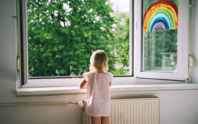 girl in newly painted room and open windows enjoying fresh air