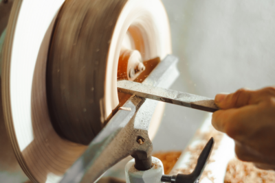 man using pole lathe to create green wood hand tools