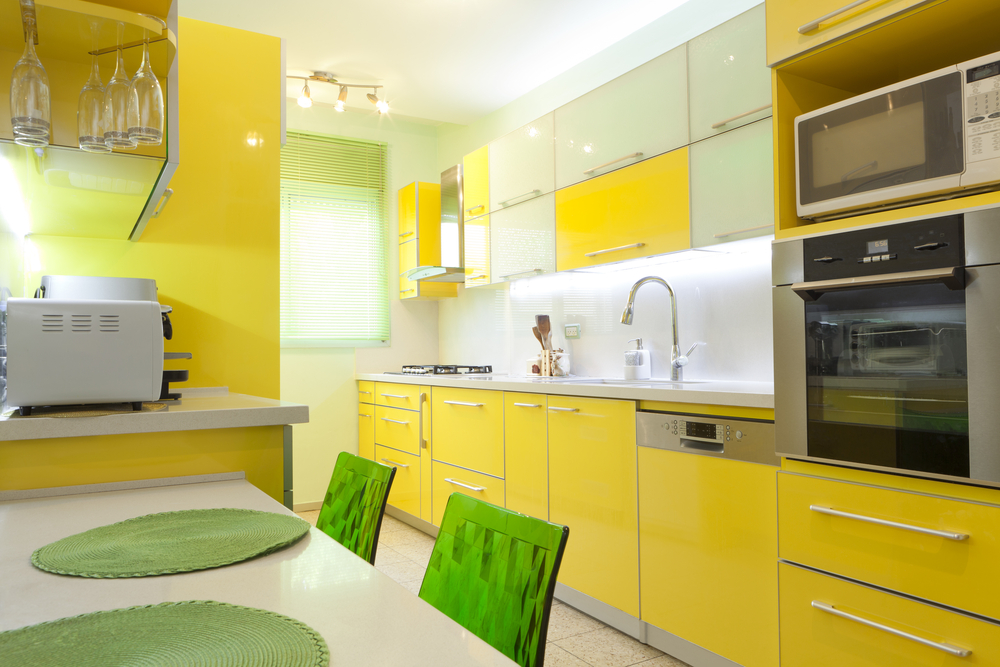 bright yellow tiny kitchen with bright color existing furniture