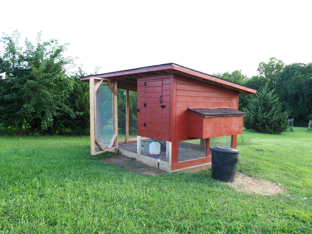 coop painted with red non-toxic milk paint which is a safe paint for chicken coops