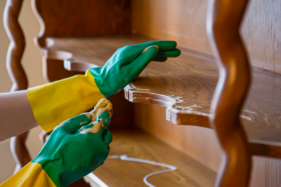 Proper cleaning techniques before applying Real Milk paint, showing how to clean antique wood furniture